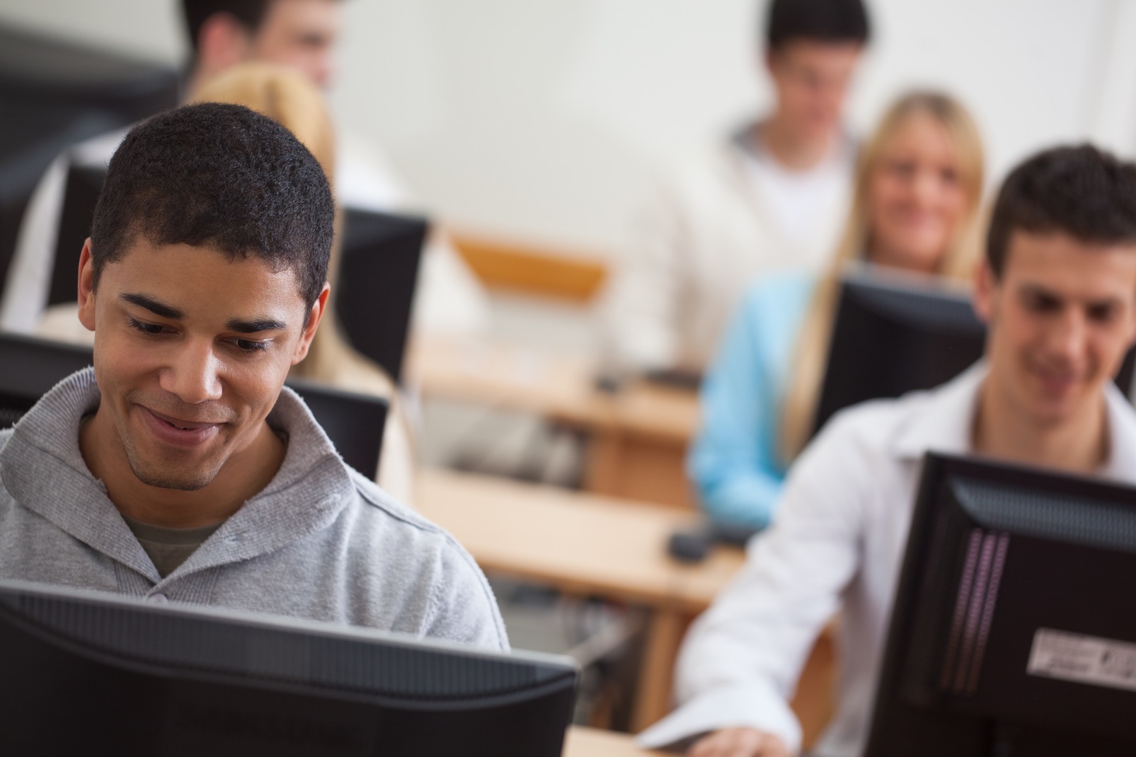 Computer students. Student Computer. Student in Computer. Computer Science pupil. Sad student at the Computer picture.